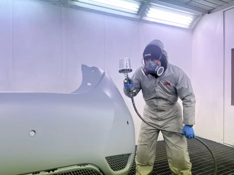 PPS Autocare technician spray painting