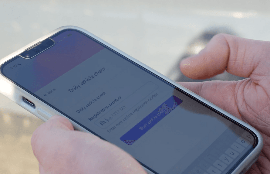 A delivery driver carrying out van checks on the PPS app